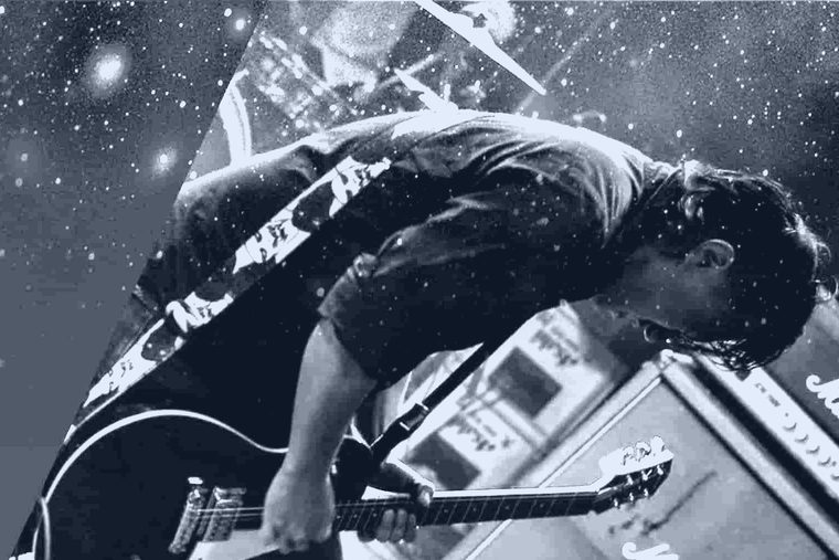 Kohei Kawabata playing guitar on stage